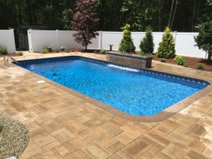 New pool with water feature - Pool Builder, Signature Pool and Spas in North Kingstown RI